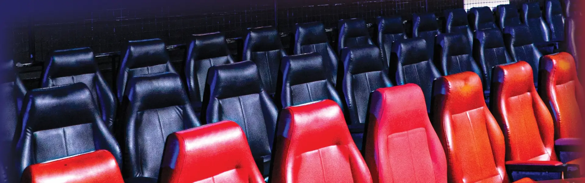Red and black RINGSIDE armchairs beside the ring at Patong Boxing Stadium